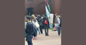 George Washington University Anti-Israel Protestor Carries Sign Calling for “Final Solution” Against Jews